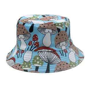Detail of light blue bucket hat featuring colorful mushroom pattern and canvas fabric