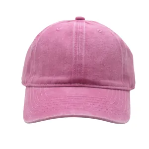Close-up of vintage washed pink cotton baseball cap with six-panel structure and curved brim