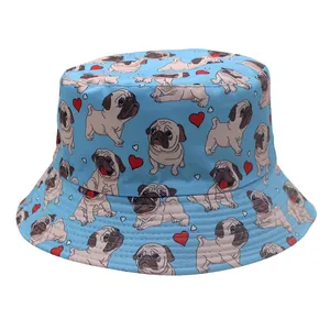 Close-up of sky blue bucket hat featuring cartoon pug and red heart pattern print