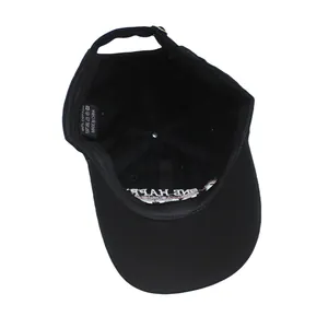 Detail view of cotton baseball cap interior with adjustable buckle and sweatband