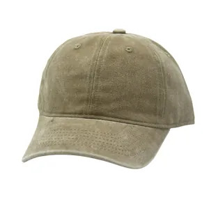 Detail of washed khaki cotton baseball cap with embroidered eyelets and vintage texture