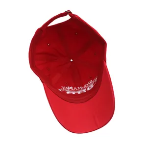 Detail view of red cotton baseball cap interior showing six-panel stitch and adjustable strap