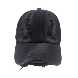 Detailed view of the vintage black washed cotton baseball cap with distressed hole effects