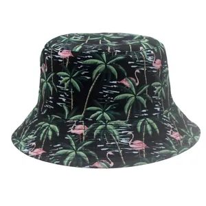 Close-up of tropical print sun hat with pink flamingos and green palm leaves
