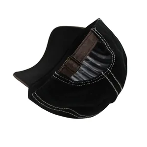 Detail view of the vintage black baseball cap with adjustable brown faux leather strap