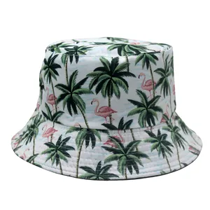 Detail of tropical bucket hat featuring green palm trees and pink flamingo print