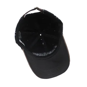 Close-up of the internal 100% cotton wash label and embroidery detail on the baseball cap