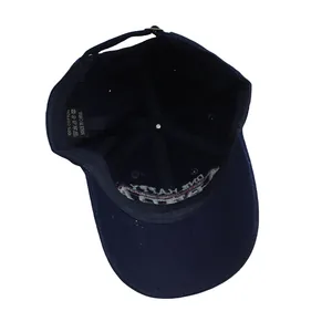 Detail view of the 100% cotton inner lining and wash label on the navy baseball cap