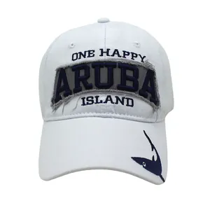 Detailed embroidery of One Happy Aruba Island text and shark graphic on a white baseball cap