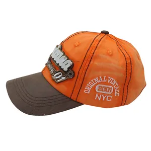 Detail of vintage baseball cap featuring distressed orange cotton and 3D NYC embroidery