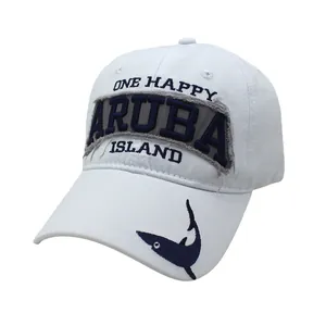 Close-up of One Happy Aruba Island embroidery and shark logo on white baseball cap
