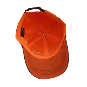 Detail view of cotton baseball cap interior with embroidery and metal buckle