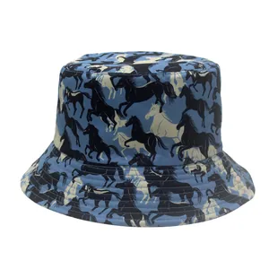 Detail of light blue bucket hat featuring galloping horse print in cotton canvas fabric