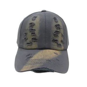 Distressed charcoal gray baseball cap with vintage wash and unique yellow bleach splatter