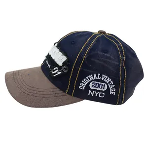 Close-up of vintage denim baseball cap with detailed NYC embroidery and yellow stitching