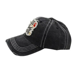 Distressed black cotton baseball cap with DOG vibes only patch and contrast stitching