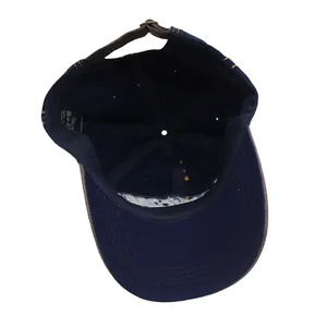 Detailed interior of vintage navy cotton baseball cap with leather back strap and cotton label