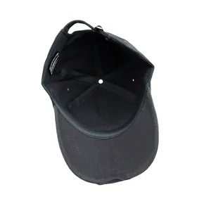 Internal view of charcoal gray baseball cap showing stitching, sweatband, and adjustable strap