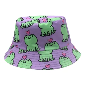 Close-up of purple bucket hat featuring green cartoon frogs and pink heart patterns