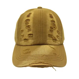 Retro distressed baseball cap in bronze with vintage torn holes and washed cotton texture