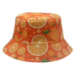 Detail of vibrant orange fruit pattern and stitching on a reversible bucket sun hat
