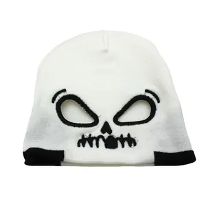 White knitted beanie with black skull face pattern for outdoor winter warmth