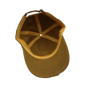 Detailed interior of vintage washed cotton baseball cap with reinforced seams and metal buckle