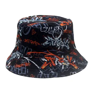 Close-up of black bucket hat featuring vibrant orange and white street graffiti print