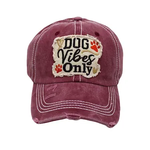 Close-up of DOG Vibes Only embroidery on washed cotton baseball cap with distressed detail