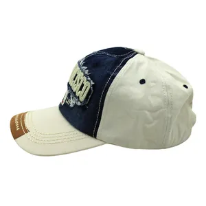 Close-up of COSO 3D embroidery on washed vintage baseball cap with distressed brim detail