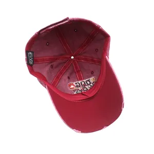 Detail view of cotton baseball cap interior with stitching and 100% cotton wash label