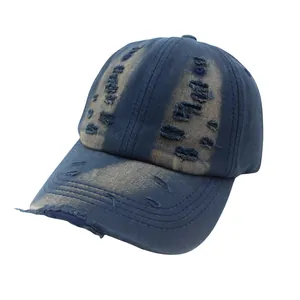 Vintage washed navy blue baseball cap with heavy distressed details and ripped brim style