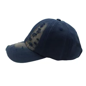 Detailed side view of washed vintage navy baseball cap with distressed edge details