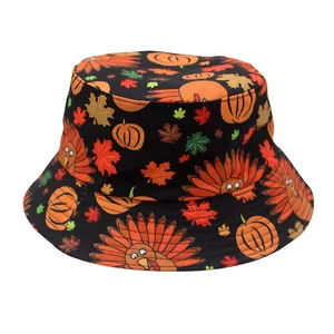 Detail of black cotton bucket hat featuring festive pumpkin, maple leaf and turkey patterns