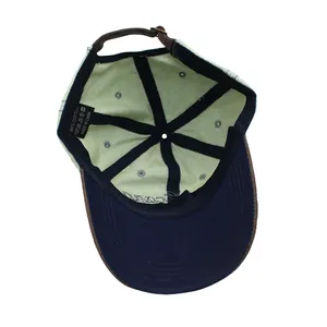 Detail view of cotton baseball cap interior featuring stitching and leather strap