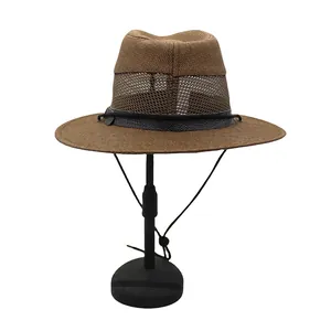 Detail view of brown woven sun hat with breathable mesh crown and leather strap