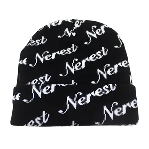Black knit beanie with white Nerest jacquard letters and a wide fold-up cuff for winter