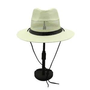 Close-up of beige straw Panama hat with breathable mesh crown and black leather trim