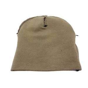 Detail view of khaki knit beanie interior stitching and durable fabric texture