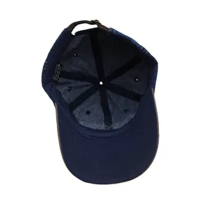 Detail of blue denim baseball cap interior showing cotton lining and wash care label