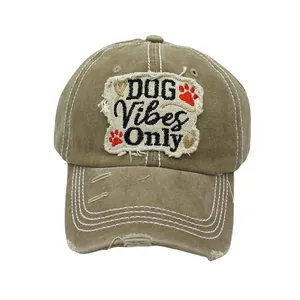 Close-up of vintage washed cotton baseball cap with DOG Vibes Only embroidery and distressed brim