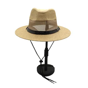Detail of breathable mesh band on straw fedora with faux leather trim and buckle