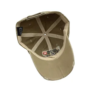 Detailed internal view of distressed cotton baseball cap with wash label and stitch details