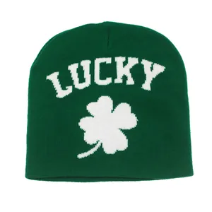 Green knit beanie with white LUCKY text and four-leaf clover pattern for autumn winter