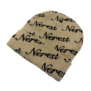 Detail of khaki Nerest letter jacquard pattern on a cuffed winter knit beanie hat