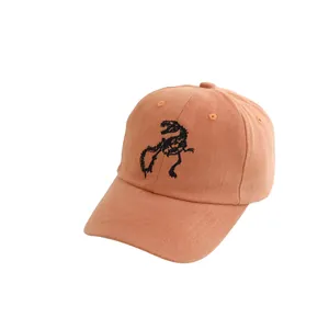 Peach corduroy baseball cap for kids with black dinosaur skeleton embroidery on the front