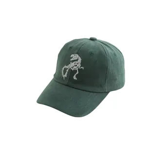 Dark green kids' washed baseball cap featuring white dinosaur skeleton embroidery