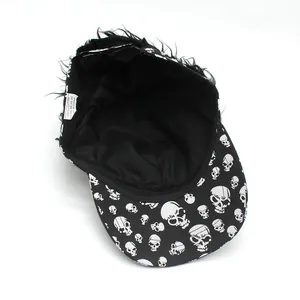 Detail view of cotton baseball cap lining and skull pattern brim with 100% cotton label