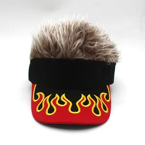 Close-up of flame embroidery details and synthetic hair on the novelty baseball cap