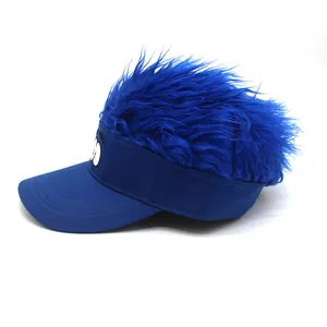 Detailed view of blue novelty visor hat with shaggy faux hair and cartoon eyes
